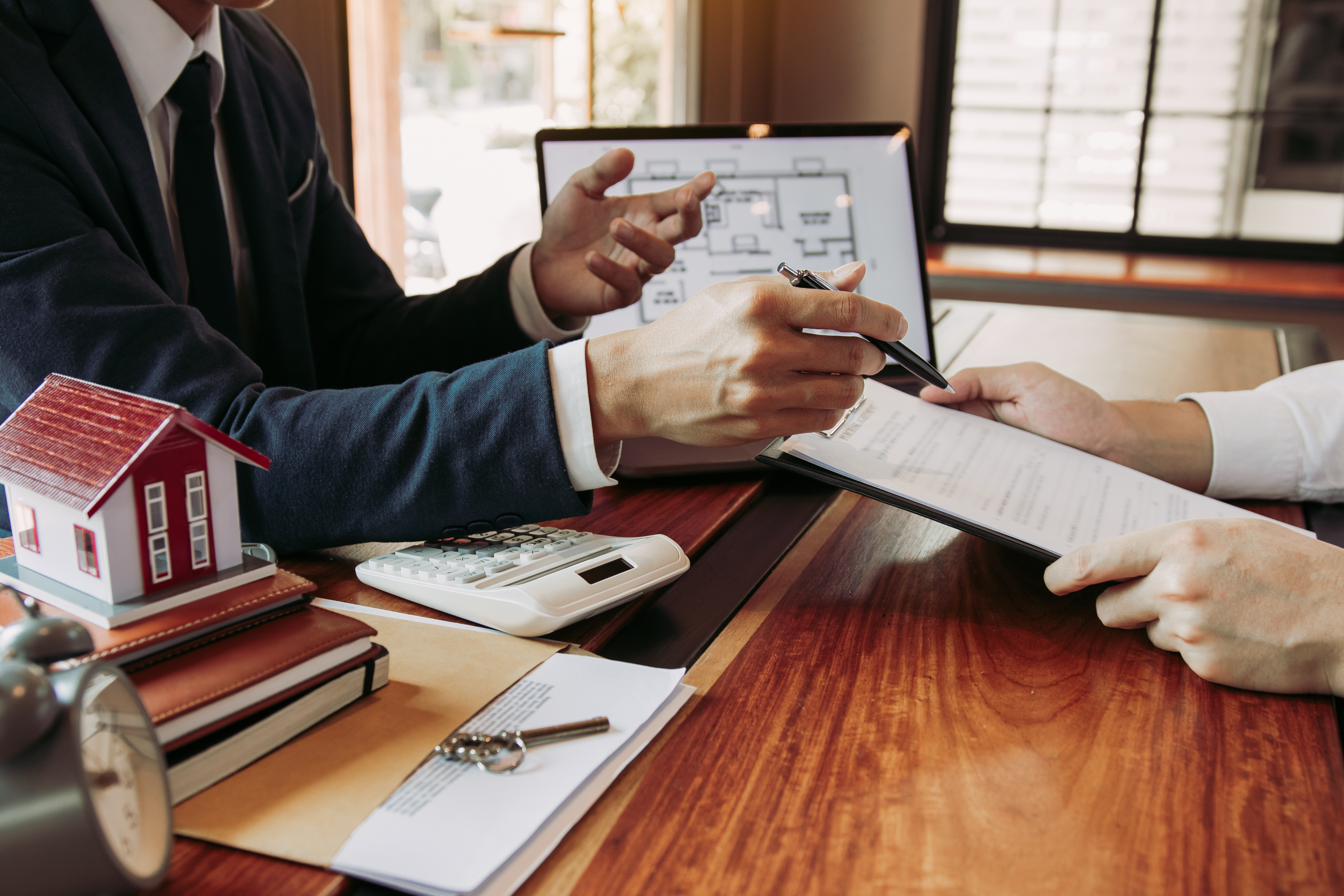 Real estate professional discussing renter insurance options with client