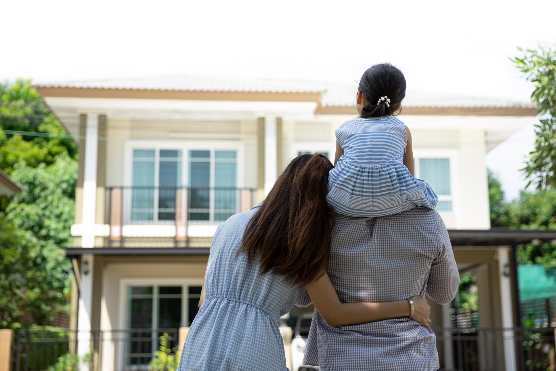 Family outside a modern South African home representing landlord and tenant home insurance cover options in 2026