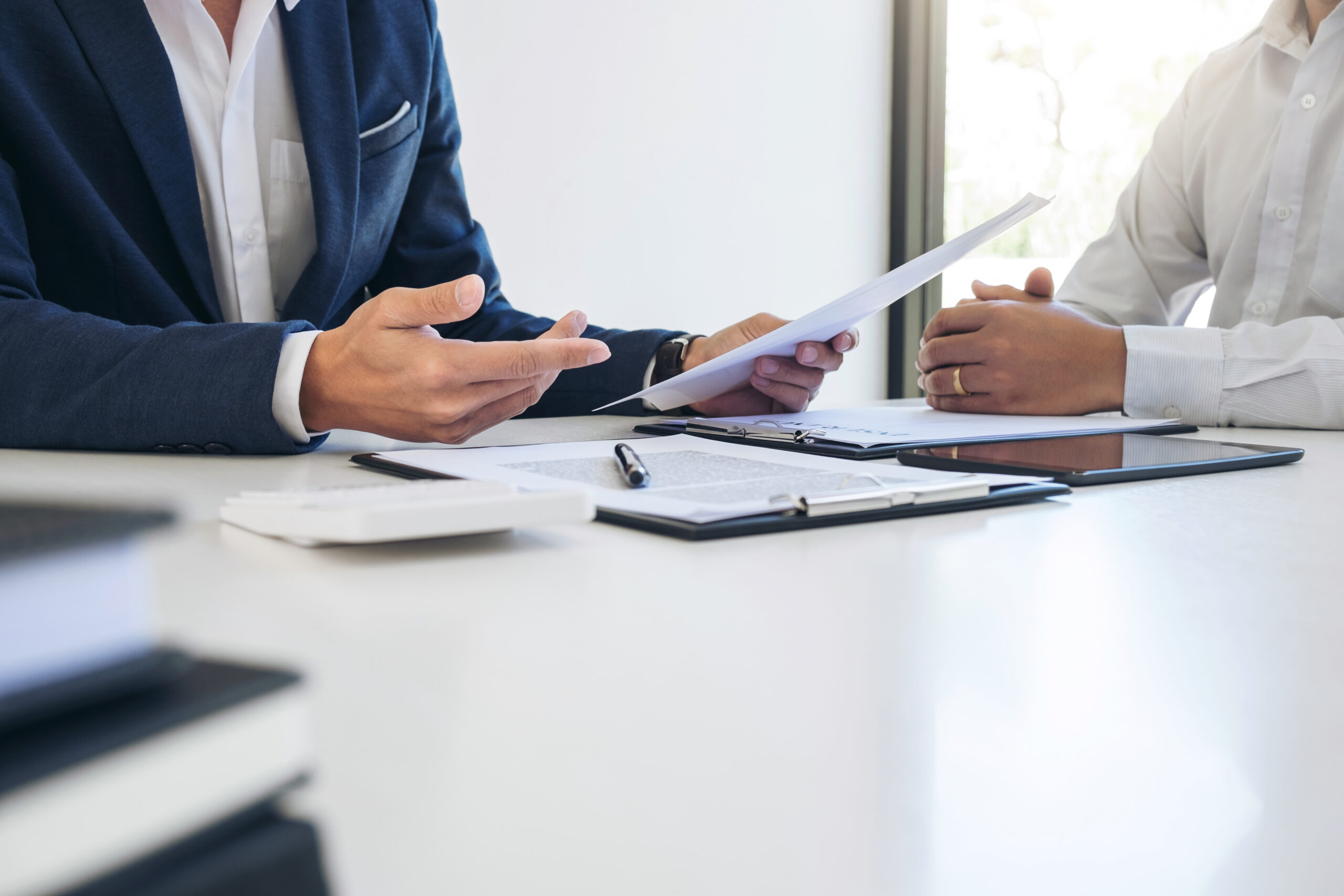 Business meeting focused on liability insurance, discussing policy details 