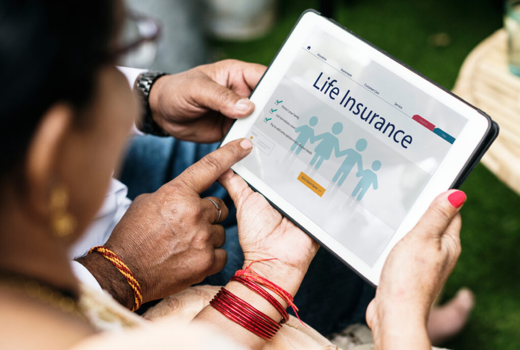 Person viewing Life Insurance Coverage information on a tablet