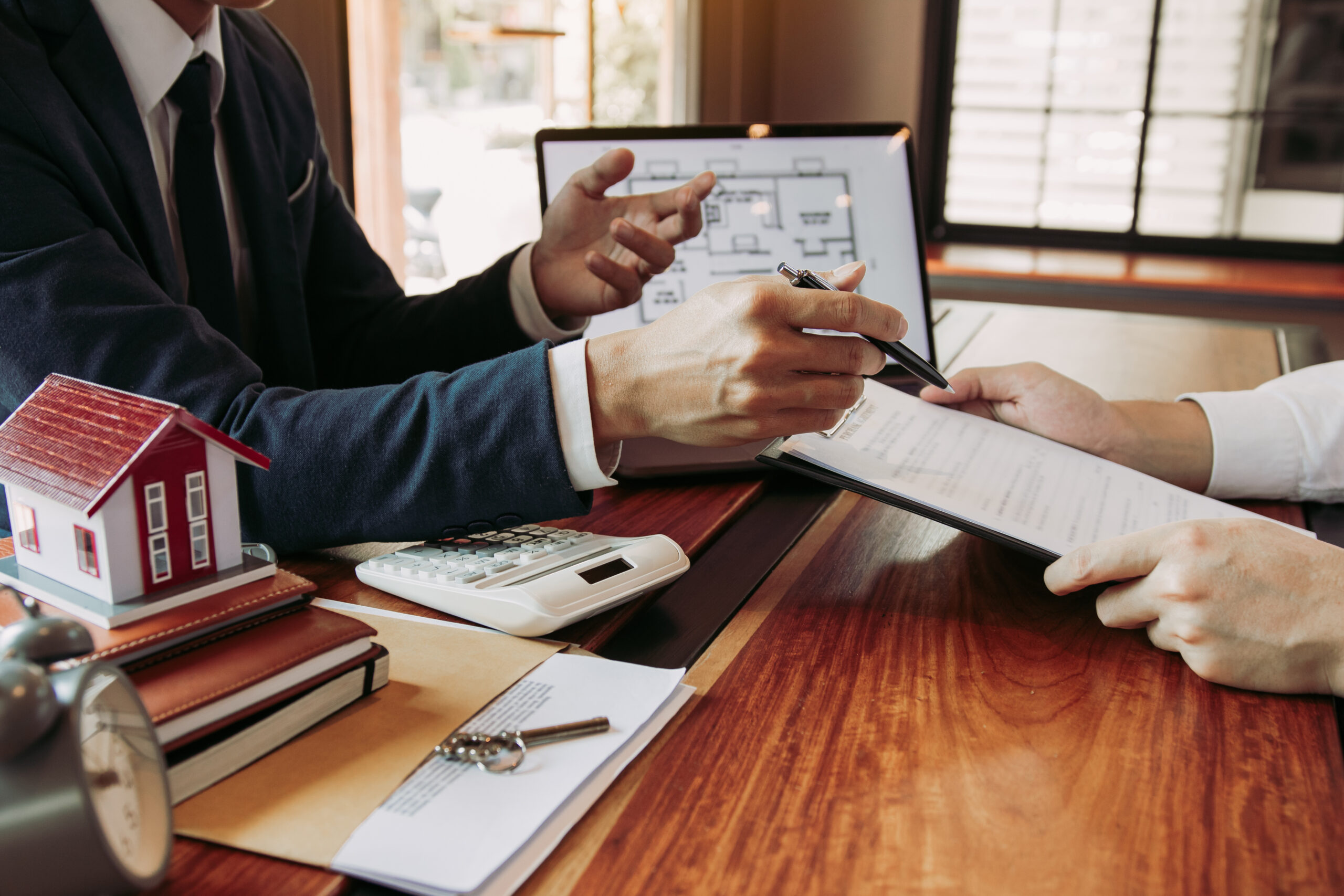 Real estate professional discussing renter insurance options with client 